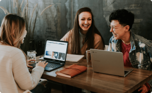 Small business team working together on a laptop
